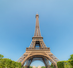 Fototapeta na wymiar World famous Tour Eiffel under a sunny sky
