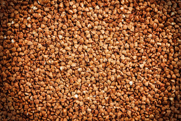 Vignetted texture of a flat buckwheat surface.