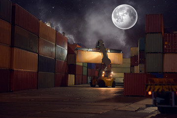 operation of container terminal at night. Unloading container ship at night. Mooring cranes unload...