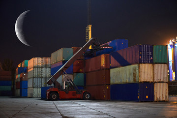 industrial port with containers in night time with moon