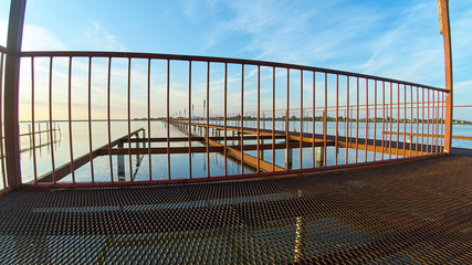 Boardwalk steel bridge over the lake