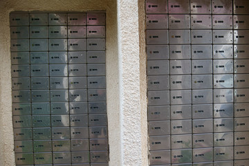 Lots of mailboxes. Small mailboxes are arranged one above the other