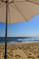 Beach and Ocean From Under An Umbrella