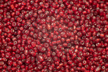 A bunch of traslucent red 8/0 seed beads