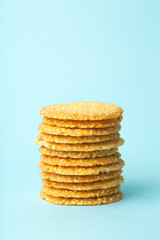 Sesame cookies on a blue background. Baking and sweets background. Home kitchen concept