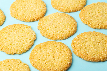 Sesame cookies on a blue background. Baking and sweets background. Home kitchen concept
