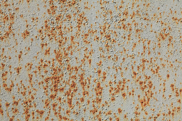 Metallic wall background, texture. An old grey and rusty surface with faded uneven colour. Abstract rust pattern on a painted surface. The wall and fence sketches and colours