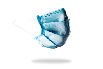 Blue medical face masks isolated on white. COVID-19