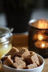 Wooden tray with tea cup and honey in a glass, cozy morning composition