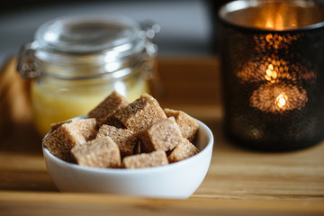 Close up photo of brown sugar bricks in a bowl, stylish food photo