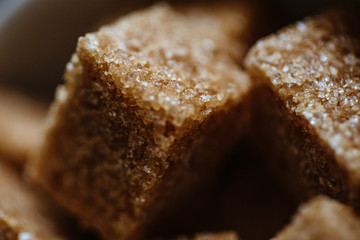 Close up photo of brown sugar bricks in a bowl, stylish food photo