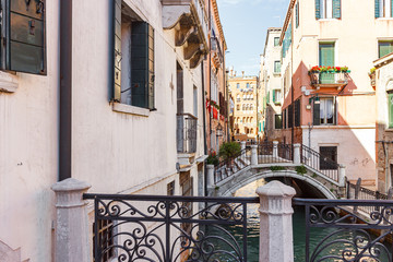 Fototapeta premium Bridges over a narrow canal in the old town of Venice, Italy