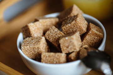 Close up photo of brown sugar bricks in a bowl, stylish food photo