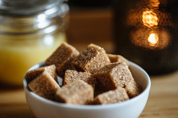 Close up photo of brown sugar bricks in a bowl, stylish food photo