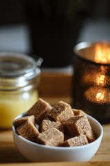 Close up photo of brown sugar bricks in a bowl, stylish food photo