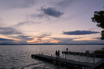 Jetty on a lake a stormy day, sunset