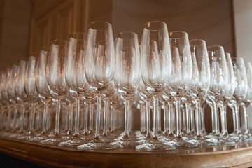 empty wine or champagne glasses lined up, table drinkware display