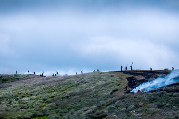 The fire of the grass on the mountain and the thick smoke