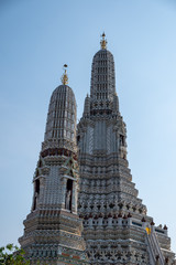 Wat Arun temple in a blue sky. Wat Arun is a Buddhist temple in Bangkok, Thailand.