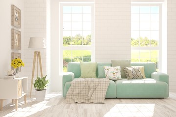 White living room with sofa and summer landscape in window. Scandinavian interior design. 3D illustration