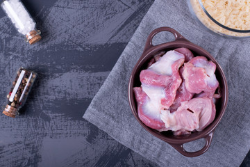 Raw chicken gizzards ready to be cooked on the grey table