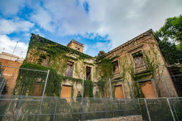 Façade of an abandoned building in a public park in Barcelona