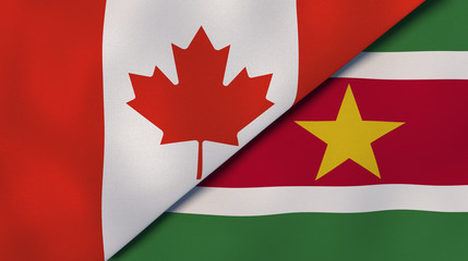 The flags of Canada and Suriname. News, reportage, business background. 3d illustration