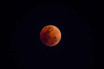 The moon that is covered by the shadow of the world is dark red