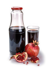 Pomegranate juice in a bottle with glass of juice, fresh pomegranate fruits