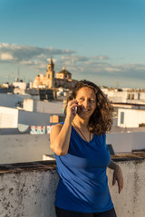 A woman talking on the phone.