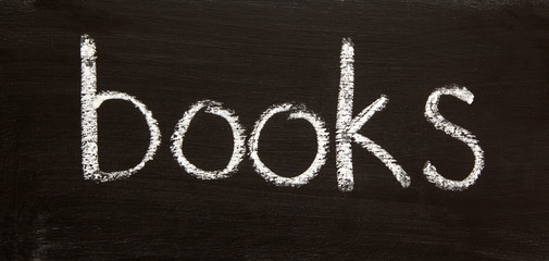 BOOKS - title word for literature, writing, authors, reading, education, teaching & language concepts & ideas - in panorama / header / banner; in real chalk letters on a chalkboard.