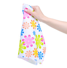 Kitchen towel flower pattern in hand on white background isolation