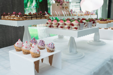 Waffle cones with ice cream on table