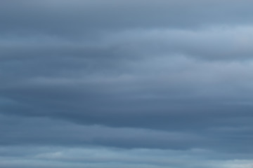 Overcast clouds is the condition of clouds covering at minimum ninety five percent of the sky. Darker skies looming storm. Sky isolated simple