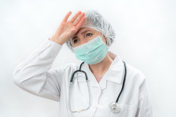 Tired doctor nurse after work in a laboratory clinic with a stethoscope.