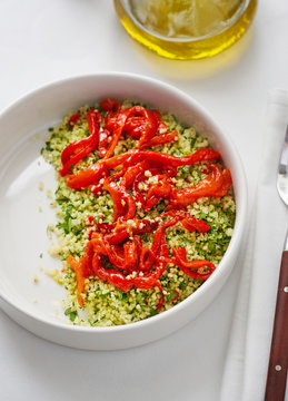 Healthy herbed couscous salad with roasted bell peppers