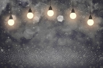 Fototapeta na wymiar blue nice bright glitter lights defocused bokeh abstract background with light bulbs and falling snow flakes fly, holiday mockup texture with blank space for your content