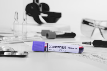 Coronavirus 2019-nCoV concept still life with blood test, drugs and laboratory flasks. COVID-19...