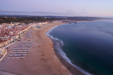 View at the end of the day over the town and beach of Nazaré