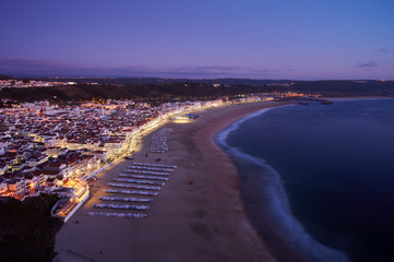 Fototapeta na wymiar View at the end of the day over the town and beach of Nazaré