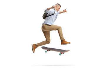 Male student jumping with a skateboard