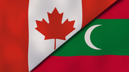 The flags of Canada and Maldives. News, reportage, business background. 3d illustration