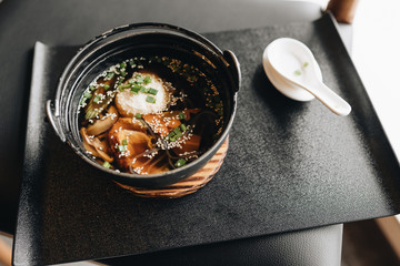 Traditional spicy ramen in bowl 