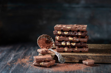 Dark chocolate over wooden background