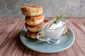 A stack of white Meat pies on a gray plate. Traditional Muslim dish. Arafat, Eid Al Adha.Place for text.