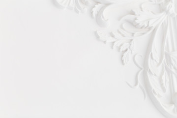 Beautiful ornate white decorative plaster moldings in studio.