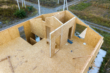 Construction of new and modern modular house. Walls made from composite wooden sip panels with...