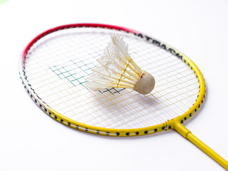 Badminton racket and White Feather Shuttlecock with a  colour white background stock isolated image. 