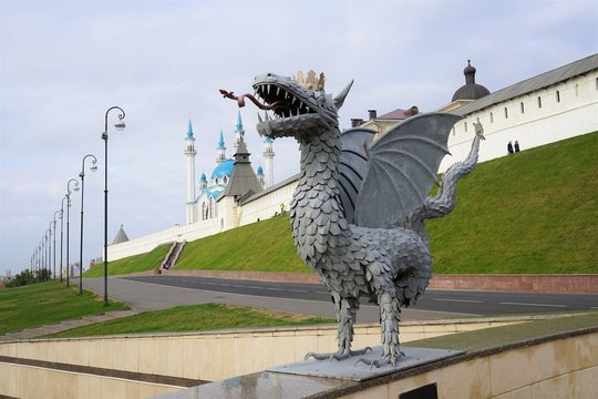 Dragon in Kazan & Kul-Sharif Mosque. KAZAN, RUSSIA &ndash; October 6, 2018: Wrought iron sculpture of Zilant, symbol of Kazan, on the background of Kazan Kremlin with Qolsharif Mosque and autumn sky