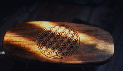 flower of life on a meditation stool in sunlight


